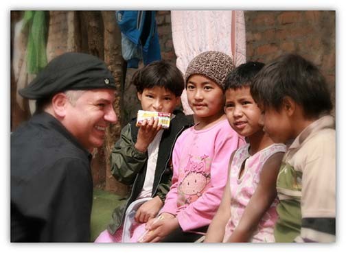 Cyrus with children of Impact-A-Life
